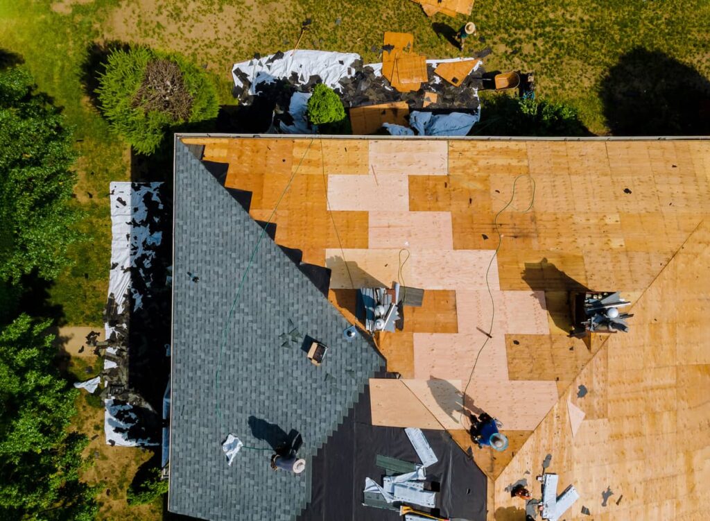 An aerial view of roofing felt installed between the roof decking and the shingles.